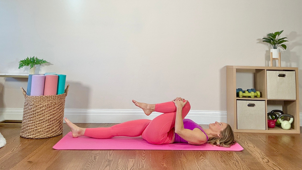 This undated image shows physical therapist and Pilates instructor Jessica Valant demonstrating a stretch movement in Colorado. (Jessica Valant via AP)