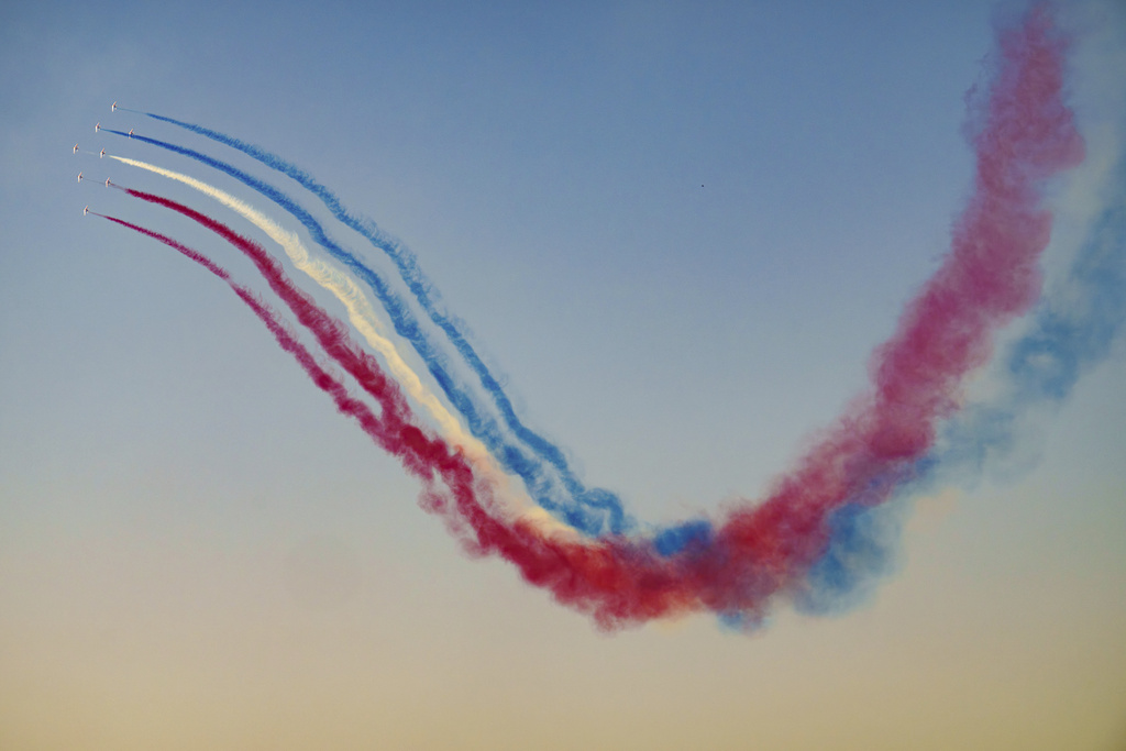 Pilots of the Patrouille de France (PAF), the precision aerobatics unit of the French Air and Space Force, perform above the runway of the Aurel Vlaicu airport, on the first day of the Bucharest International Air Show, BIAS 2025 in Bucharest, Romania, Saturday, Aug. 30, 2025. (AP Photo/Andreea Alexandru)