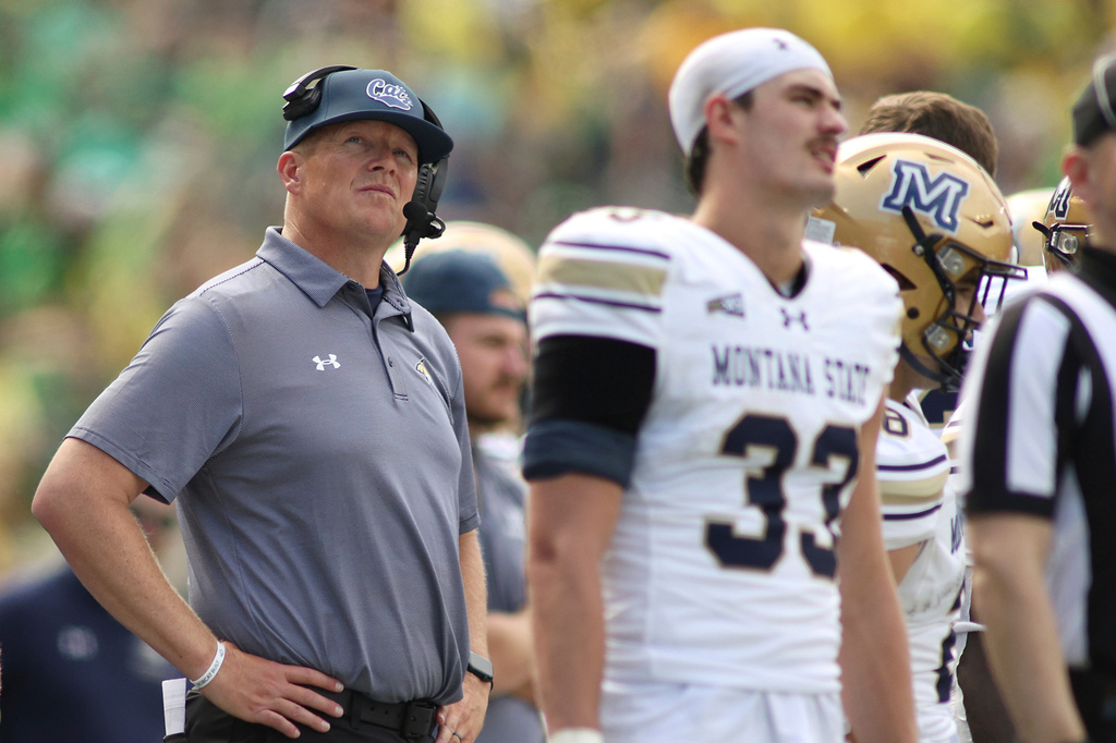 FILE - Montana State head coach Brent Vigen, center, waits for a referee's call during the second half of an NCAA college football game against Oregon, Saturday, Aug. 30, 2025, in Eugene, Ore. (AP Photo/Lydia Ely, File)