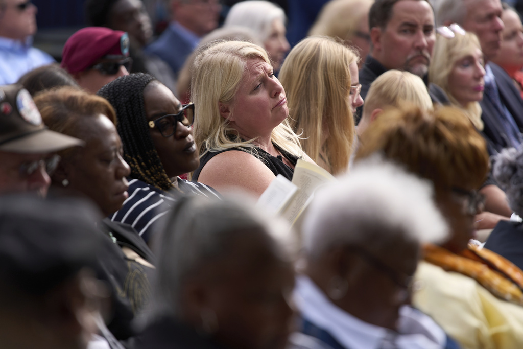 People listen as names of those killed are read during a ceremony attended by President Donald Trump to commemorate the 24th anniversary of the 9/11 attacks, Thursday, Sept. 11, 2025, at the Pentagon in Washington. (AP Photo/Evan Vucci)