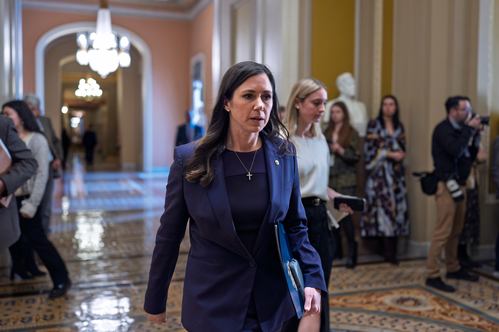 Sen. Katie Britt, R-Ala., who chairs the Department of Homeland Security Appropriations Subcommittee, walks to the chamber following a closed-door meeting with fellow Republicans on spending legislation, at the Capitol in Washington, Wednesday, Jan. 28, 2026. (AP Photo/J. Scott Applewhite)