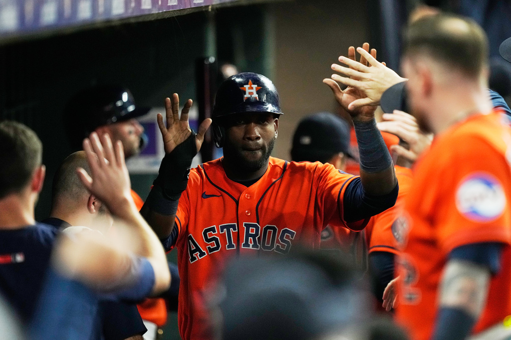 Houston Astros designated hitter Yordan Alvarez (44) celebrates in the dugout after scoring during the fourth inning of a baseball game against the Atlanta Braves in Houston, Friday, Sept. 18, 2026. (AP Photo/Ashley Landis)