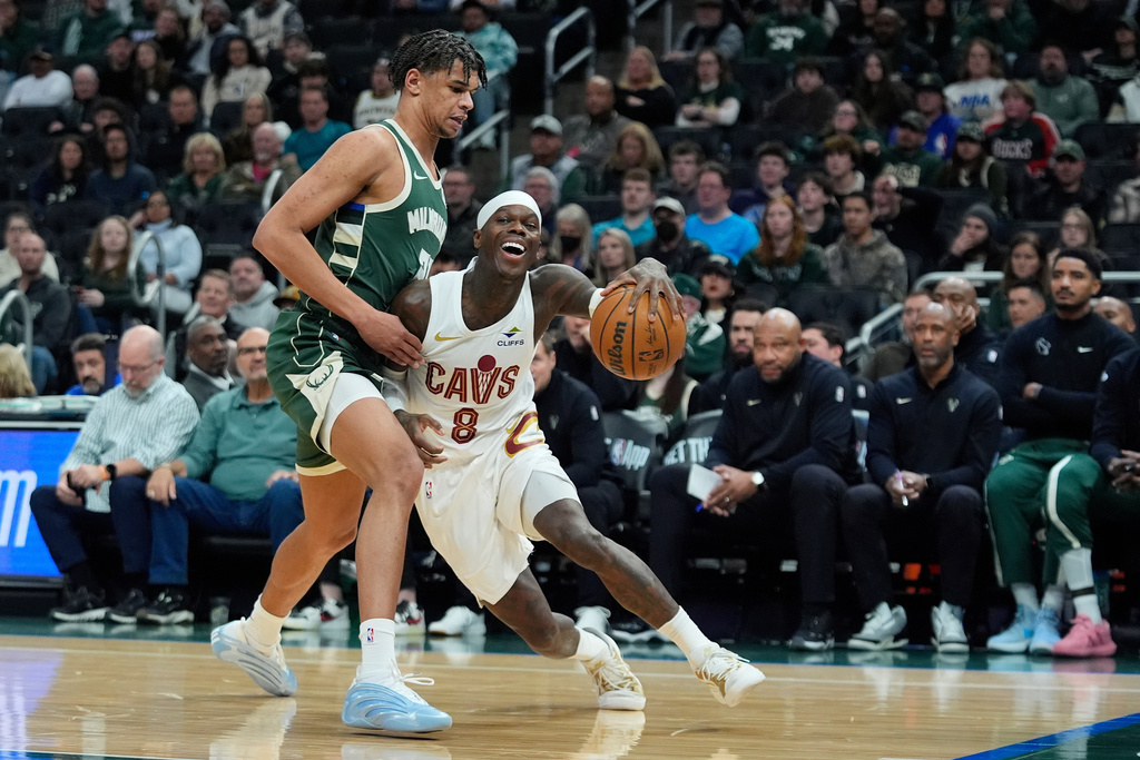 Cleveland Cavaliers' Dennis Schroder (8) drives to the basket against Milwaukee Bucks' Ousmane Dieng during the first half of an NBA basketball game, Tuesday, March 17, 2026, in Milwaukee. (AP Photo/Aaron Gash)