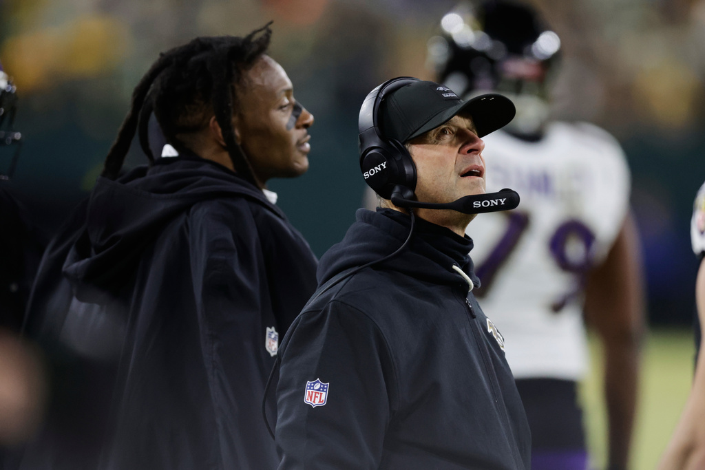 Baltimore Ravens head coach John Harbaugh watches during the first half of an NFL football game against the Green Bay Packers, Saturday, Dec. 27, 2025, in Green Bay, Wis. (AP Photo/Matt Ludtke)