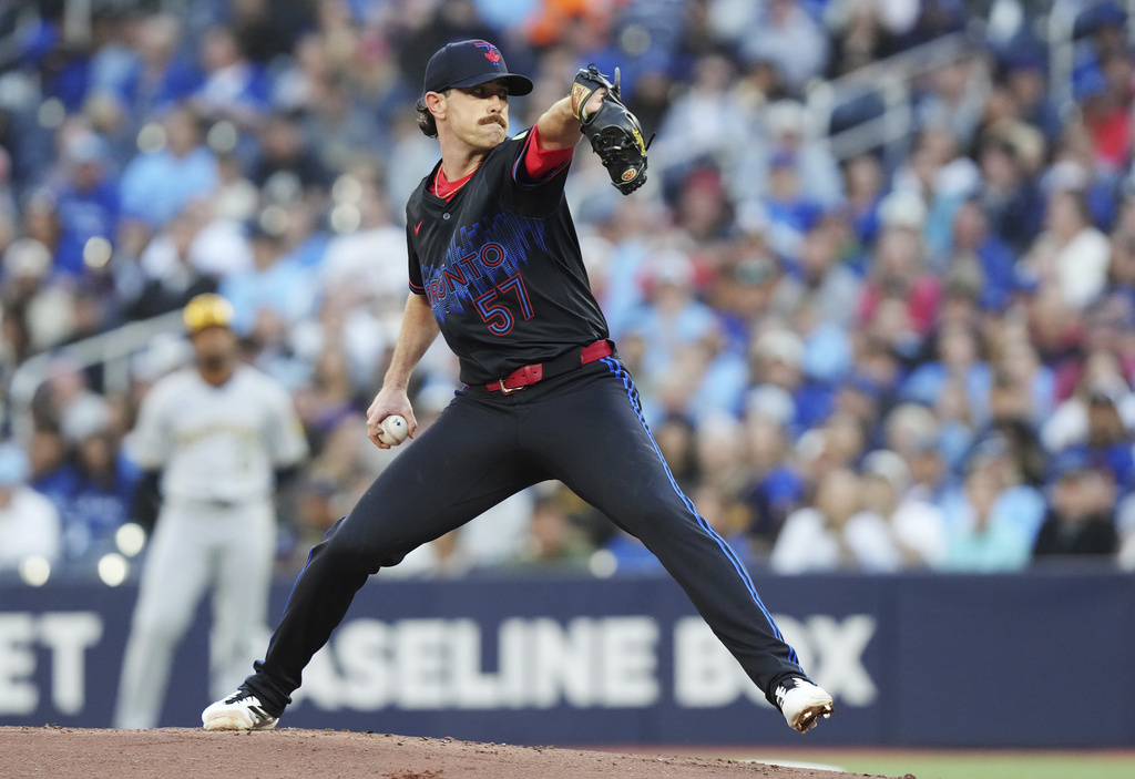 Toronto Blue Jays pitcher Shane Bieber (57) works against the Milwaukee Brewers during first inning MLB baseball action in Toronto on Friday, August 29, 2025. (Chris Young/The Canadian Press via AP)