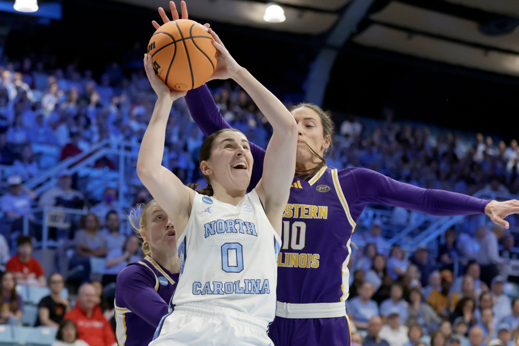 North Carolina guard Lanie Grant (0) drives against Western Illinois forward Mallory Shetley (10) during the first half in the first round of the NCAA college basketball tournament Friday, March 20, 2026, in Chapel Hill, N.C. (AP Photo/Chris Seward)