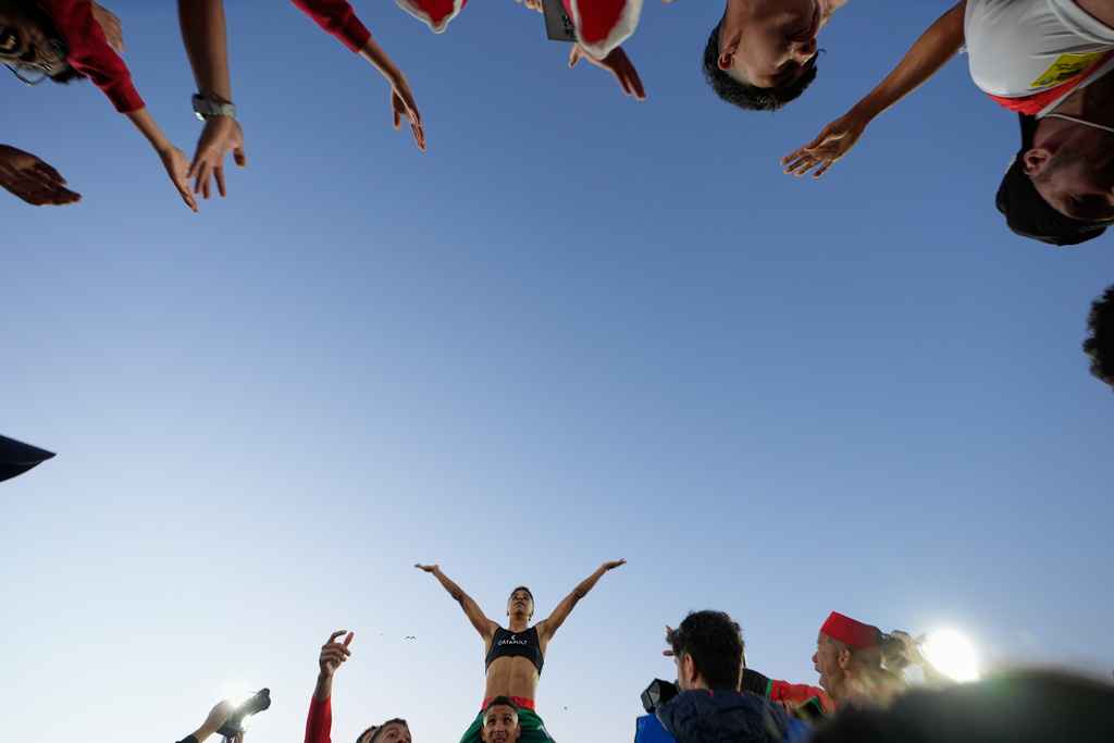 Morocco's Fouad Zahouani celebrates with fans after defeating France in a penalty shootout during a FIFA U-20 World Cup semifinal soccer match at Elias Figueroa Brander Stadium in Valparaiso, Chile, Oct. 15, 2025. (AP Photo/Matias Delacroix)