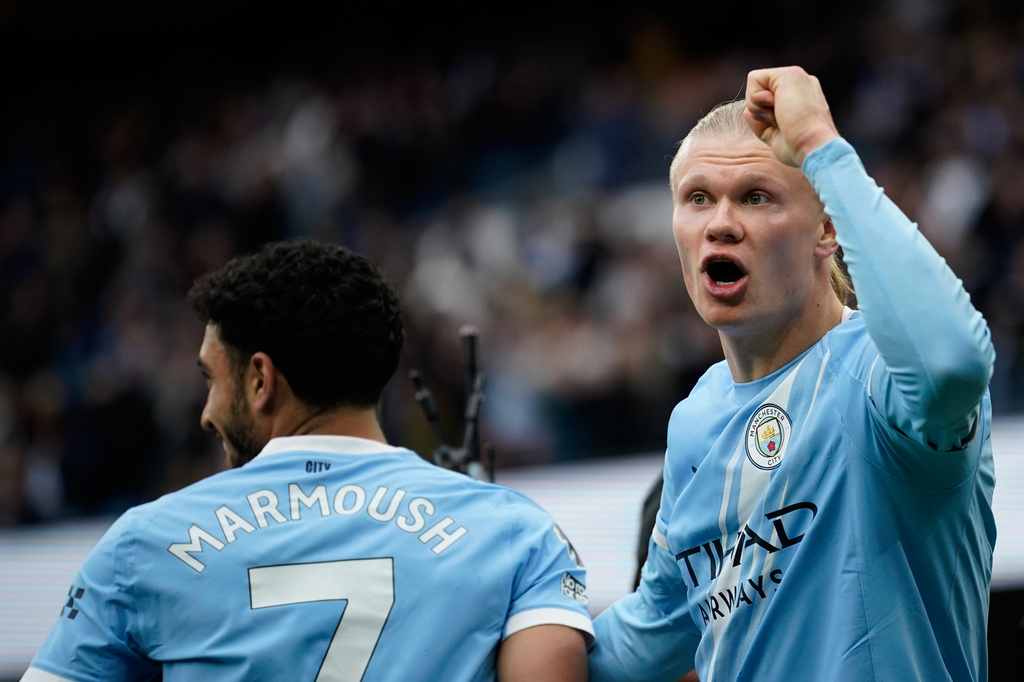 Manchester City's Erling Haaland, right, celebrates with Manchester City's Omar Marmoush after scoring his side's opening goal during the English Premier League soccer match between Manchester City and Brentford in Manchester, Saturday, May 9, 2026. (AP Photo/Dave Thompson)