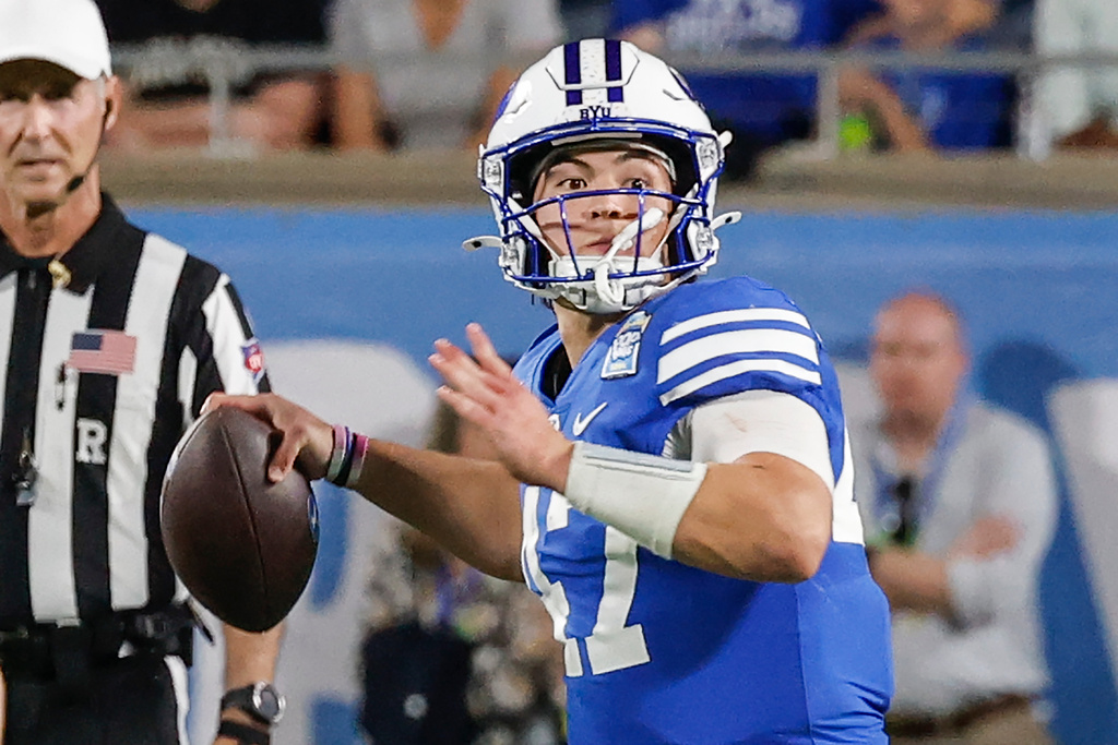 BYU quarterback Bear Bachmeier (47) passes the ball down field against Georgia Tech during the second half of the Pop-Tarts Bowl NCAA college football game, Saturday, Dec. 27, 2025, in Orlando, Fla. (AP Photo/Kevin Kolczynski)