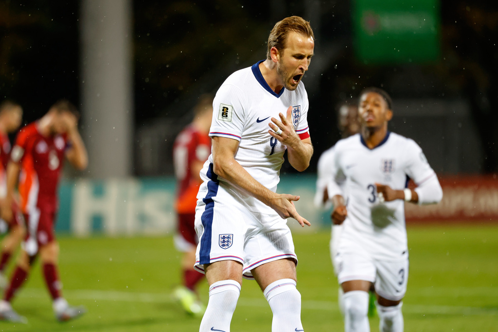 England's Harry Kane celebrates after scoring his side's third goal during the 2026 World Cup group K qualifying soccer match between Latvia and England in Riga, Latvia, Tuesday, Oct. 14, 2025. (AP Photo/Mindaugas Kulbis)
