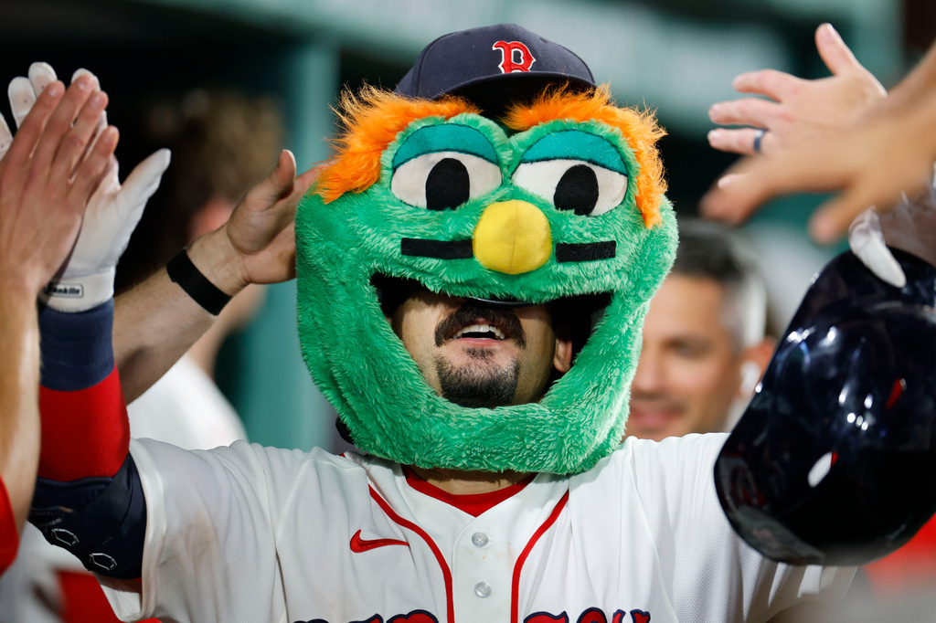 Boston Red Sox designated hitter Mickey Gasper celebrates in the dug out after hitting a solo home run during the sixth inning of a baseball game against the Arizona Diamondbacks Tuesday, Aug. 18, 2026, in Boston. (AP Photo/CJ Gunther)