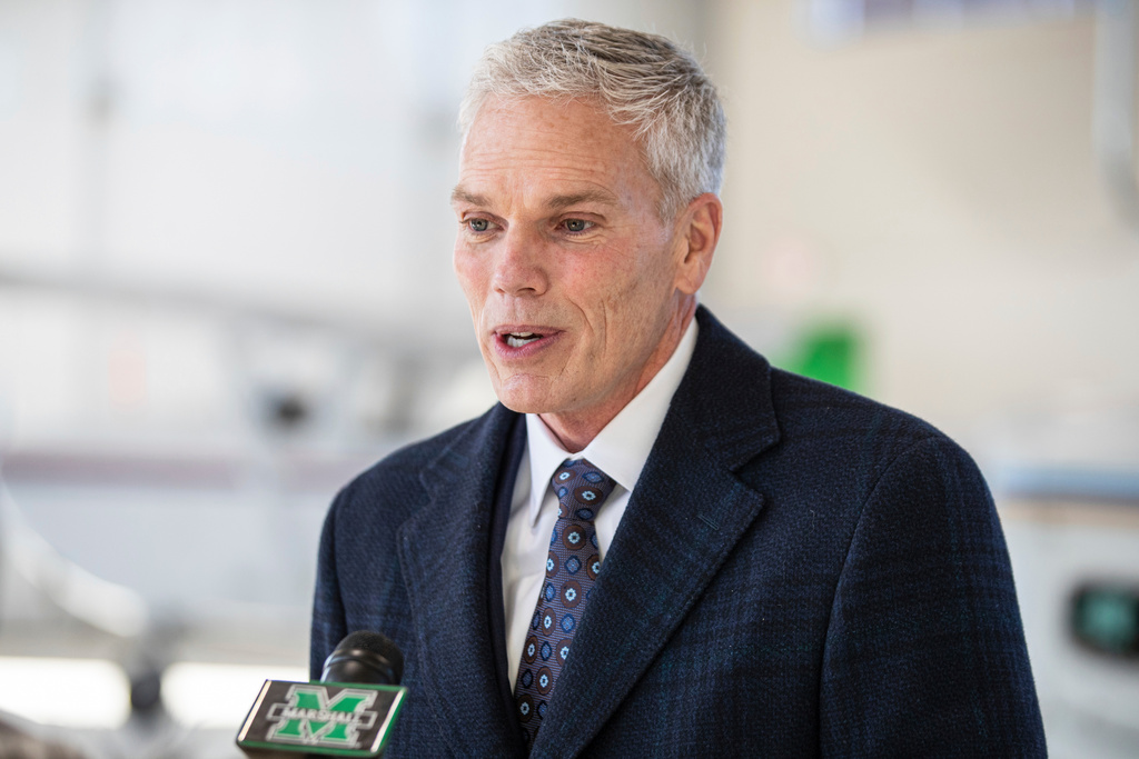 FILE - Marshall University President Brad Smith speaks with members of the media, Jan. 26, 2022, at the Huntington Tri-State Airport, in Huntington, W.Va. (Sholten Singer/The Herald-Dispatch via AP, File)