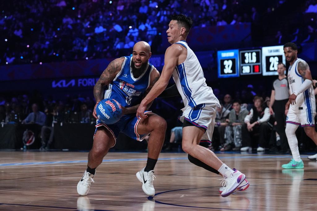 Jeremy Lin, right, pressures Keenan Allen during an NBA basketball's All-Star Celebrity Game Friday, Feb. 13, 2026, in Inglewood, Calif. (AP Photo/Jae C. Hong)