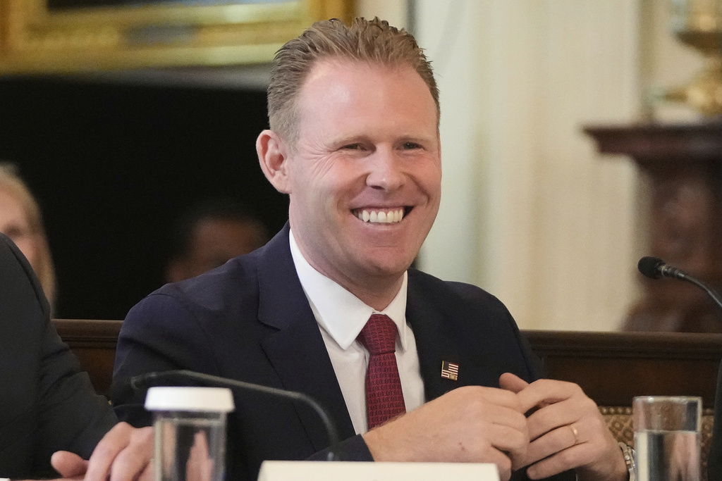 FILE - Andrew Giuliani listens as President Donald Trump speaks during a FIFA task force meeting on the 2026 FIFA World Cup in the East Room of the White House, May 6, 2025, in Washington. (AP Photo/Mark Schiefelbein, File)