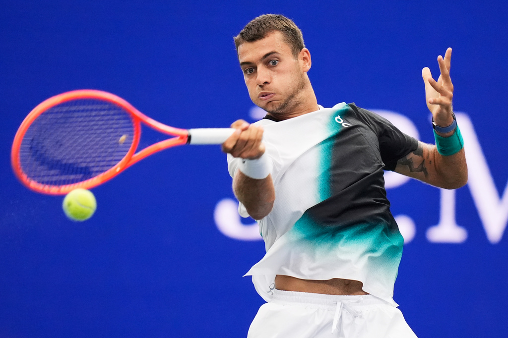 Flavio Cobolli, of Italy, returns the ball to Francisco Comesana, of Argentina, during the first round of the U.S. Open tennis championships, Tuesday, Sept. 1, 2026, in New York. (AP Photo/Seth Wenig)