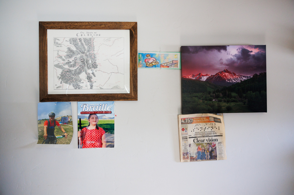 Newspaper clippings featuring Isabelle Harris are pinned to the wall of her home on Thursday, June 18, 2026, in Grand Junction, Colo. (AP Photo/Jacob Spetzler)