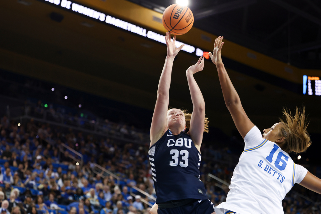 California Baptist forward Grace Schmidt (33) shoots against UCLA forward Sienna Betts (16) during the first half in the first round of the NCAA college basketball tournament, Saturday, March 21, 2026, in Los Angeles. (AP Photo/Jessie Alcheh)