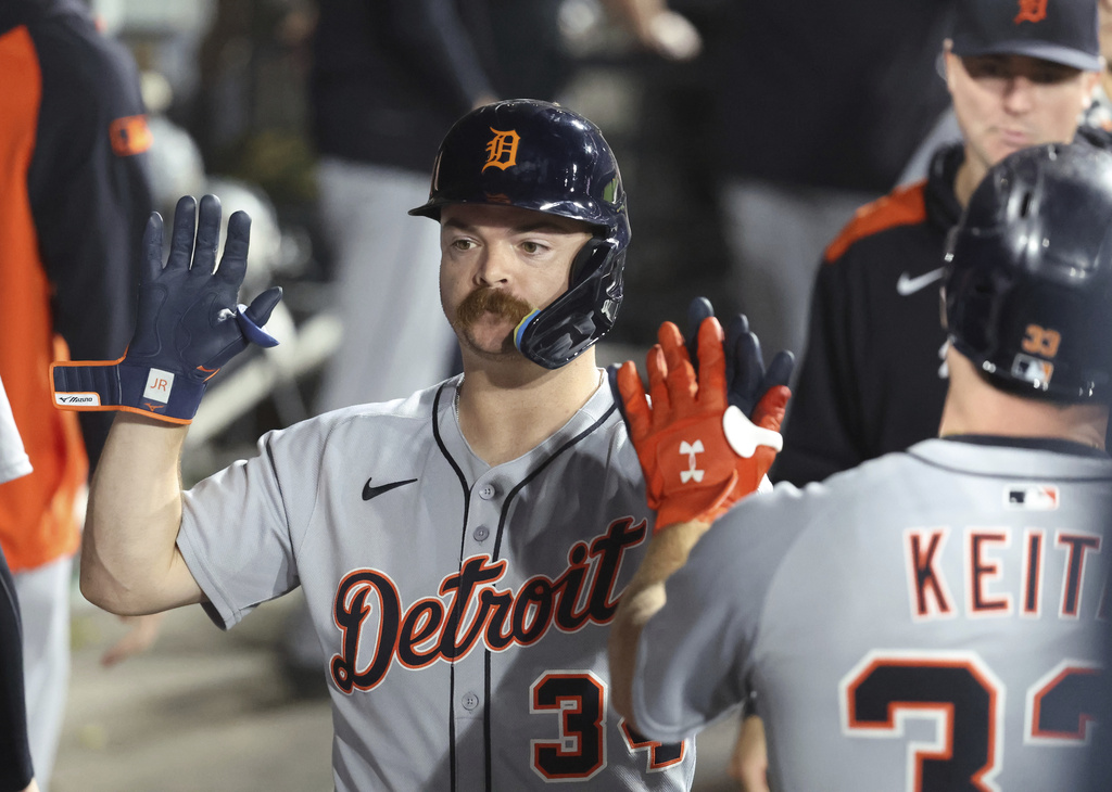 Detroit Tigers catcher Jake Rogers (34) celebrates a three run home run during the ninth inning against the Chicago White Sox in a baseball game, Tuesday, Aug. 12, 2025, in Chicago. (AP Photo/Talia Sprague)