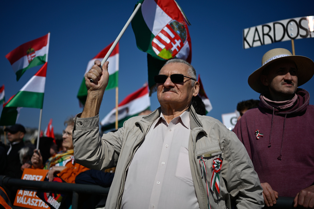 Supporters of Prime Minister Viktor Orban take part in a march in Budapest, Hungary, Sunday, March 15, 2026. (AP Photo/Denes Erdos)
