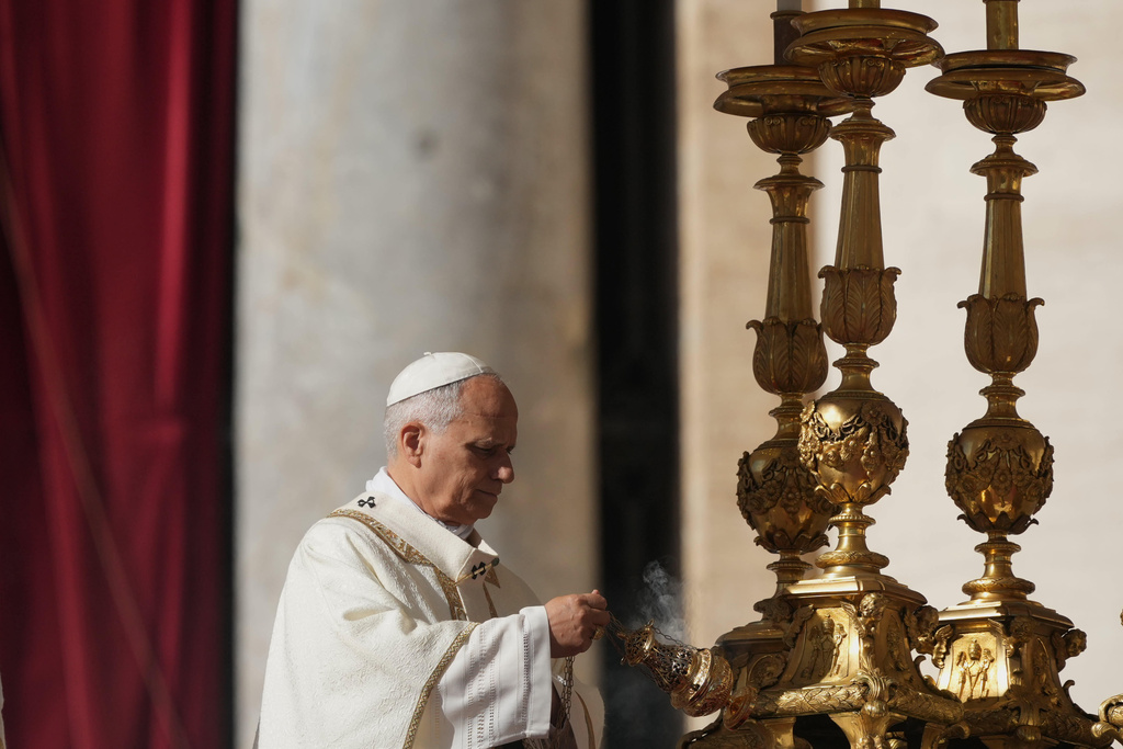 Pope Leo XIV presides over Mass with participants in the Jubilee of the Educational World on the Solemnity of All Saints, in St. Peter's Square, at the Vatican, Saturday, Nov. 1, 2025, during which he will proclaim St. John Henry Newman a Doctor of the Church. (AP Photo/Andrew Medichini)