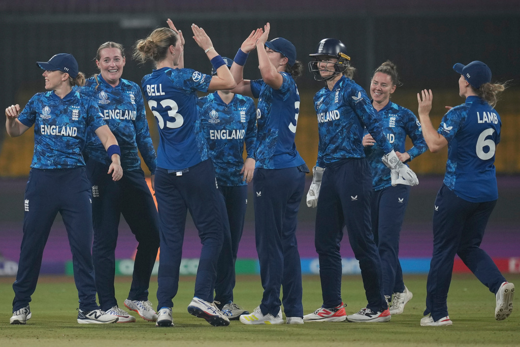 England's Sophie Ecclestone, second from left, celebrates the wicket of Australia's Beth Mooney during the ICC Women's Cricket World Cup cricket match between England and Australia at Holkar Cricket Stadium in Indore, India, Wednesday, Oct. 22, 2025. (AP Photo/Rafiq Maqbool)