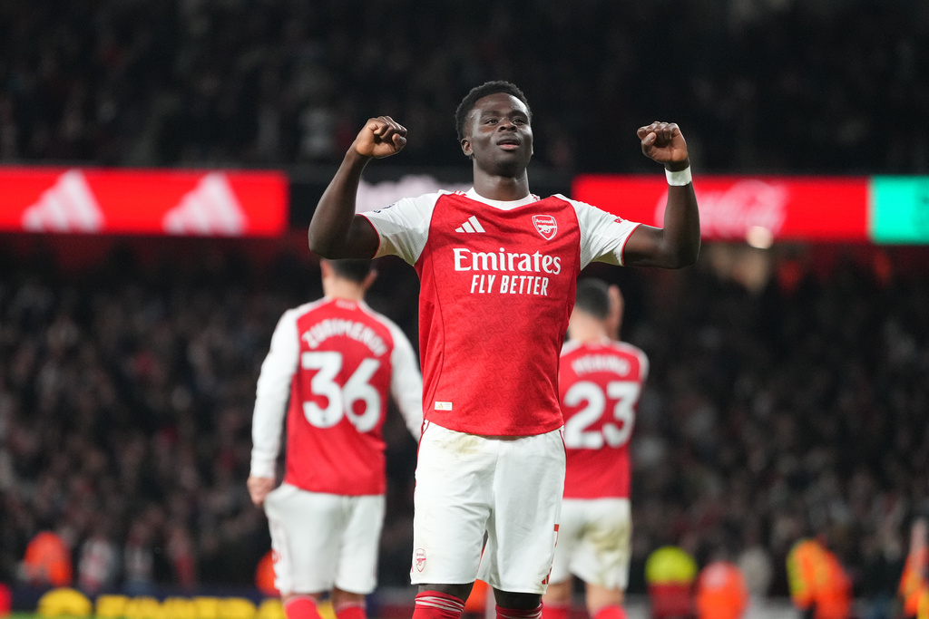 Arsenal's Bukayo Saka celebrates after scoring during a Premier League soccer match between Arsenal and Brentford in London, Wednesday, Dec. 3, 2025. (AP Photo/Kirsty Wigglesworth)