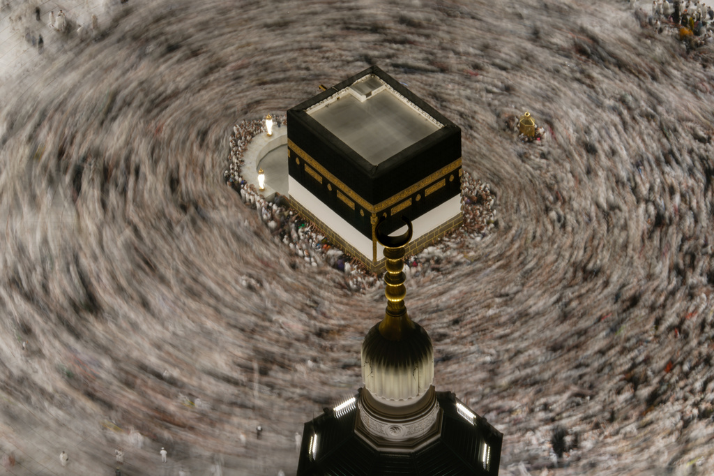 This photograph made with a slow shutter speed shows Muslim pilgrims circumambulating the Kaaba, Islam's holiest site at the Grand Mosque during the annual Hajj pilgrimage in Mecca, Saudi Arabia, Sunday, May 24, 2026. (AP Photo/Altaf Qadri)