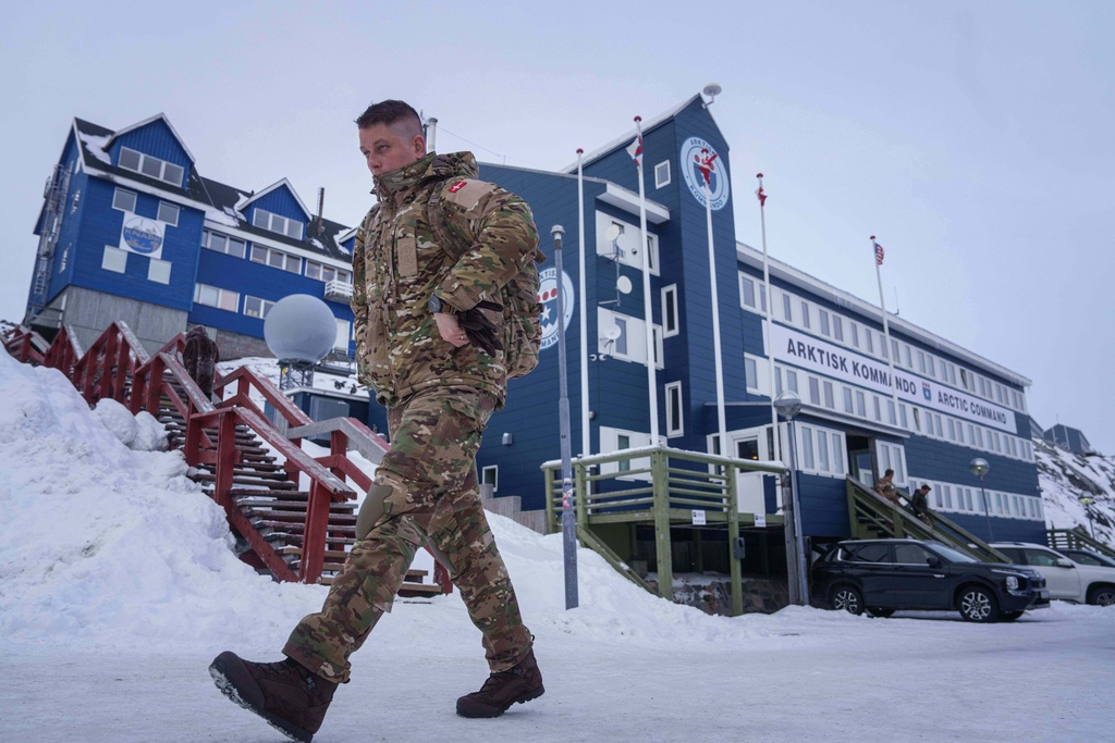 A Danish serviceman walks in front of Joint Arctic Command center in Nuuk, Greenland, on Friday, Jan. 16, 2026. (AP Photo/Evgeniy Maloletka)