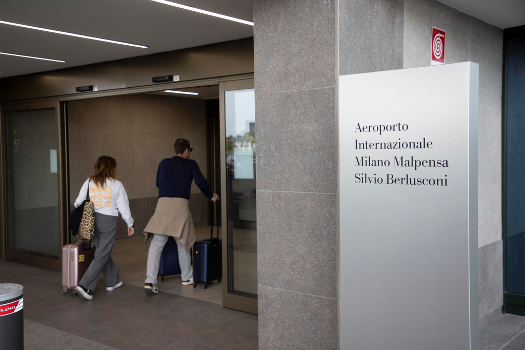 Passengers arrive at Italy’s second-busiest airport, Milan Malpensa, that was officially named after the late former Premier Silvio Berlusconi, in Somma Lombardo, Italy, Friday, Sept. 25, 2026. (Marco Ottico/LaPresse via AP)