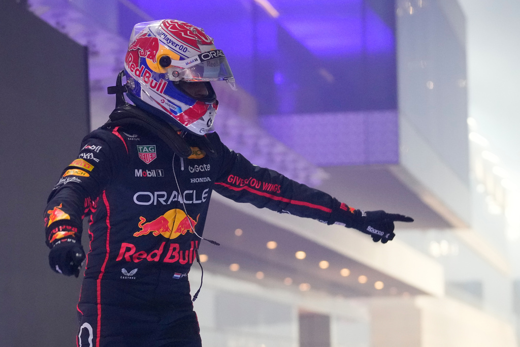 Red Bull driver Max Verstappen of the Netherlands celebrates after winning the Qatar Formula One Grand Prix, at the Lusail International Circuit, in Lusail, Qatar, Sunday, Nov. 30, 2025. (AP Photo/Darko Bandic)