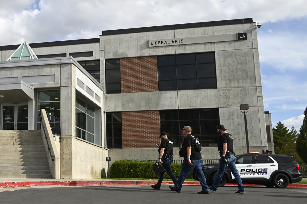 Law enforcement enters a building at Utah Valley University on Wednesday, Sept. 10, 2025, in Orem, Utah. (AP Photo/Alex Goodlett)