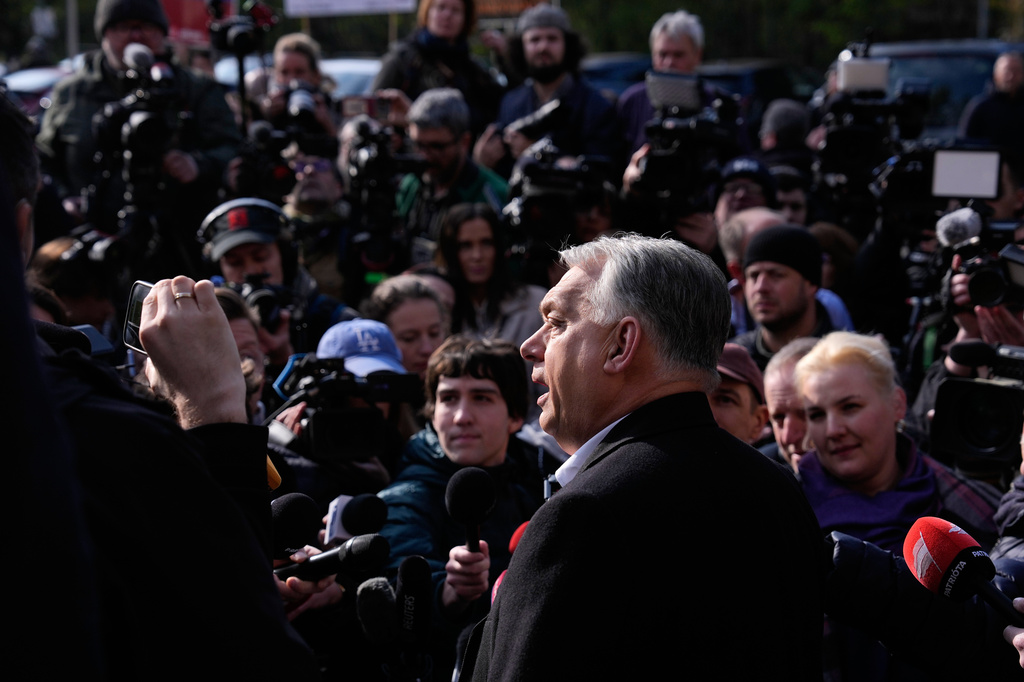 Hungary's Prime Minister Viktor Orban addresses the media outside a polling station after voting in Budapest, Hungary, Sunday, April 12, 2026. (AP Photo/Petr David Josek)