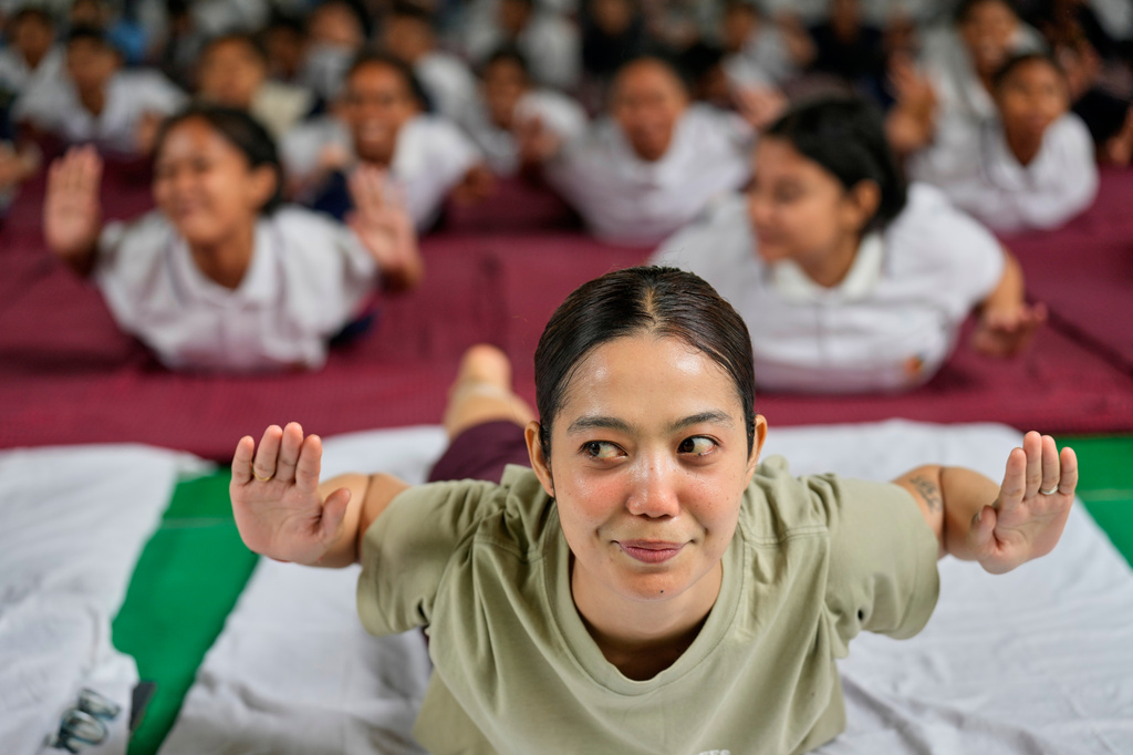 Students perform yoga during an event to mark International Yoga Day in Guwahati, India, Sunday, June 21, 2026. (AP Photo/Anupam Nath)