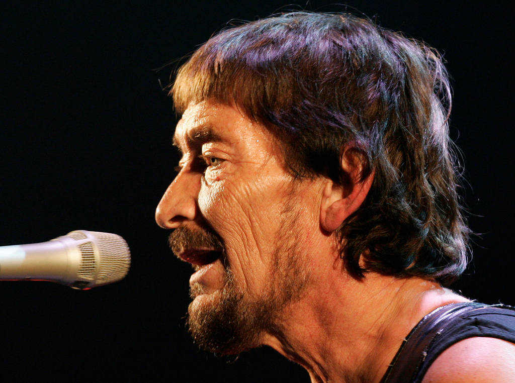 FILE - British rock musician Chris Rea performs during his first German concert of "The Return of the Fabulous Bluenotes" tour in Munich, Germany, on Feb. 7, 2008. (AP Photo/Christof Stache, File)