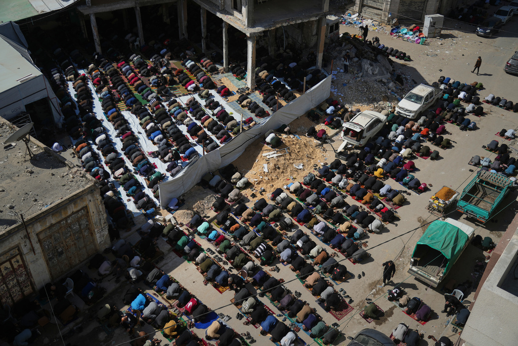 Muslim worshippers perform Friday prayer during the holy fasting month of Ramadan at the Alkanz Mosque, which was damaged during the Israel–Hamas war, in Gaza City, Friday, Feb. 20, 2026. (AP Photo/Jehad Alshrafi)