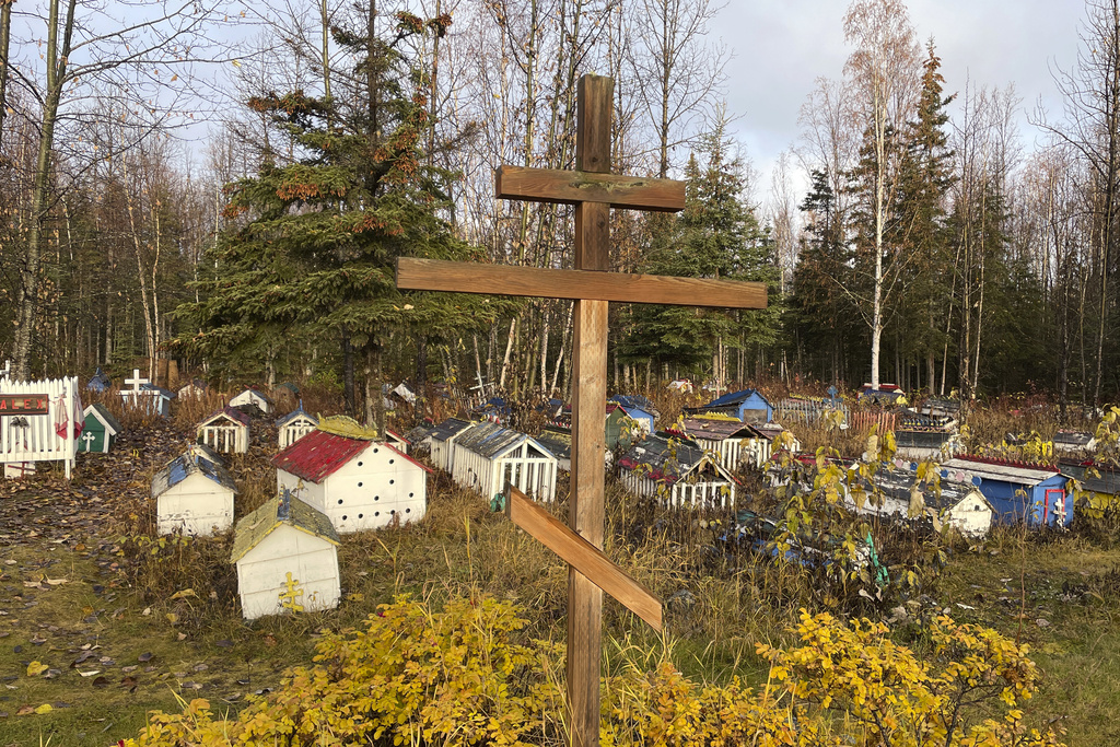 FILE - The cemetery at St. Nicholas Church in Eklutna, Alaska, features a mixture of Russian Orthodox conventions like crosses featuring three cross beams and the Dena'ina Athabascan tradition of erecting spirit homes above the graves, on Oct. 13, 2023. (AP Photo/Mark Thiessen, File)