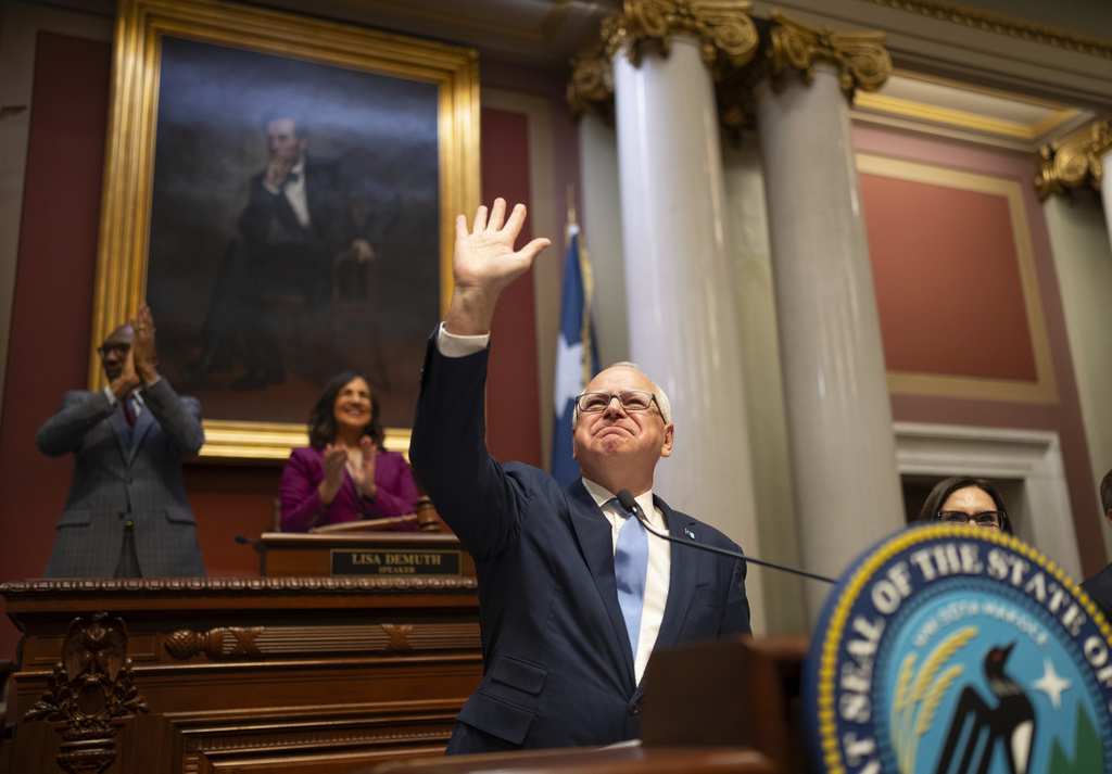 FILE - Minnesota Gov. Tim Walz acknowledges the applause of the House chamber before he delivers his State of the State address before a joint session of the Legislature at the state Capitol in St. Paul, Minn., April 23, 2025. (Jeff Wheeler/Star Tribune via AP, file)
