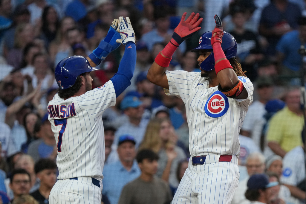 Chicago Cubs' Kevin Alcantara, right, is greeted by Dansby Swanson after hitting a two-run home run against the Los Angeles Dodgers during the second inning of a baseball game, Monday, Aug. 3, 2026, in Chicago. (AP Photo/David Banks)