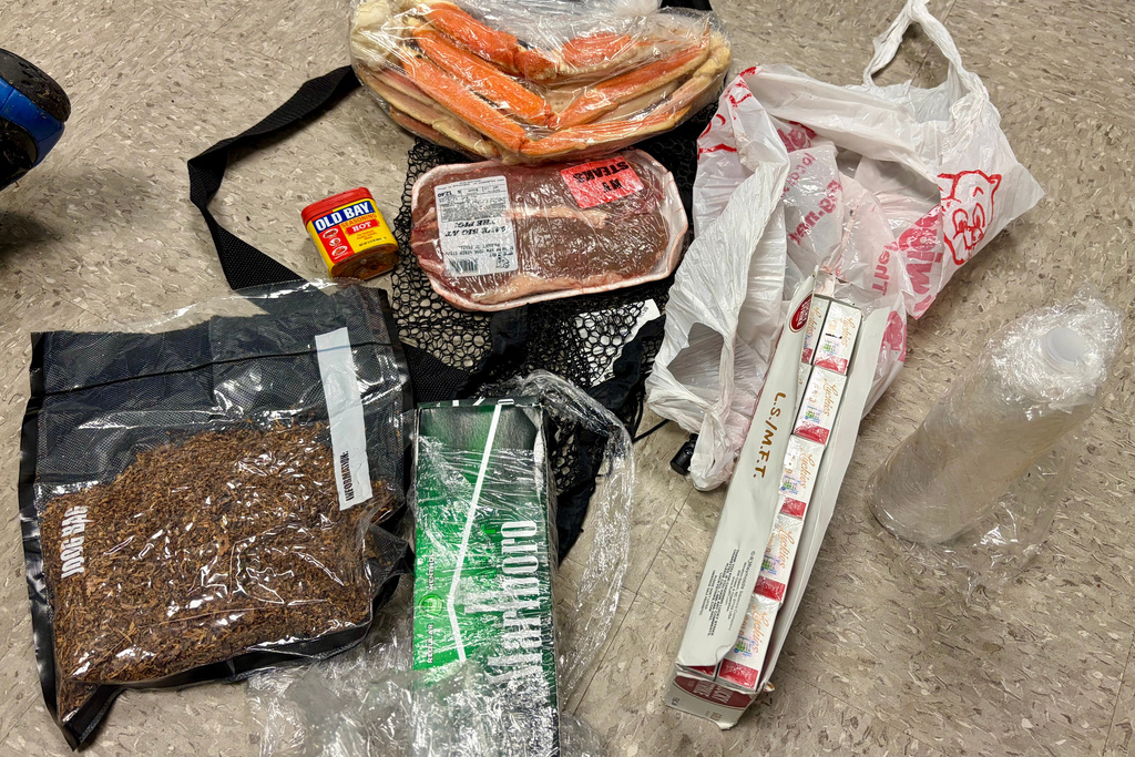 In this undated photo released by the South Carolina Department of Corrections, items dropped by a drone into the Lee Correctional Institution in Bishopville, S.C., are seen. (South Carolina Department of Corrections via AP)