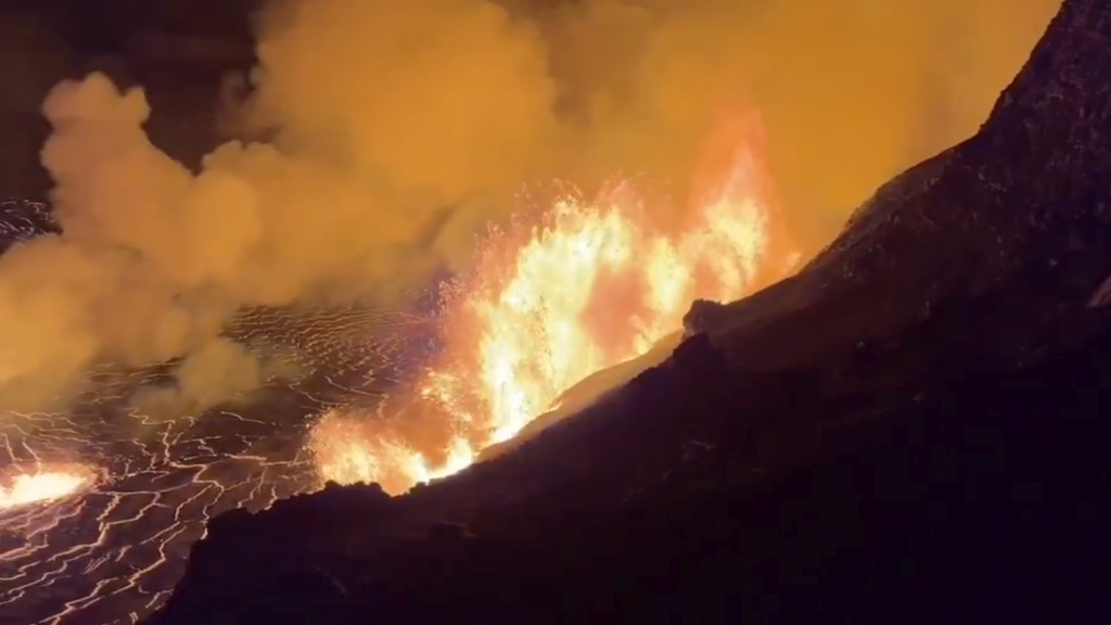FILE - This image from video provided by the U.S. Geological Survey shows a lava lake erupting on the west caldera wall of the Kīlauea volcano in Hawaii, on Dec. 23, 2024. (USGS via AP, File)