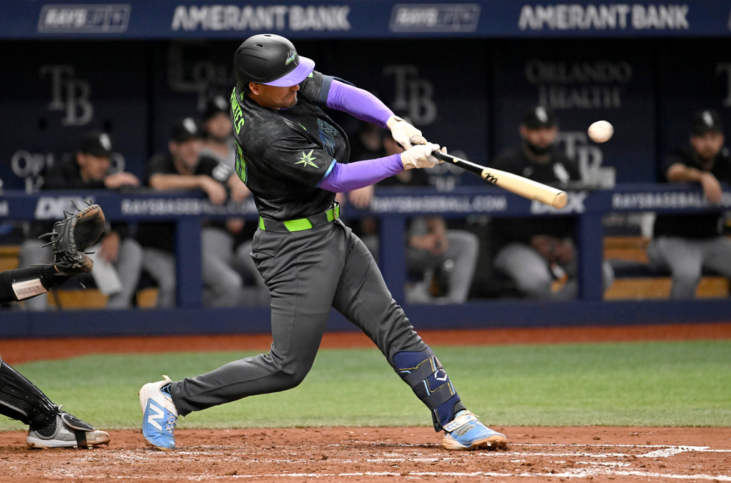 Tampa Bay Rays' Nick Fortes hits an RBI single during the fifth inning of a baseball game against the Chicago White Sox Saturday, Aug. 1, 2026, in St. Petersburg, Fla. (AP Photo/Jason Behnken)