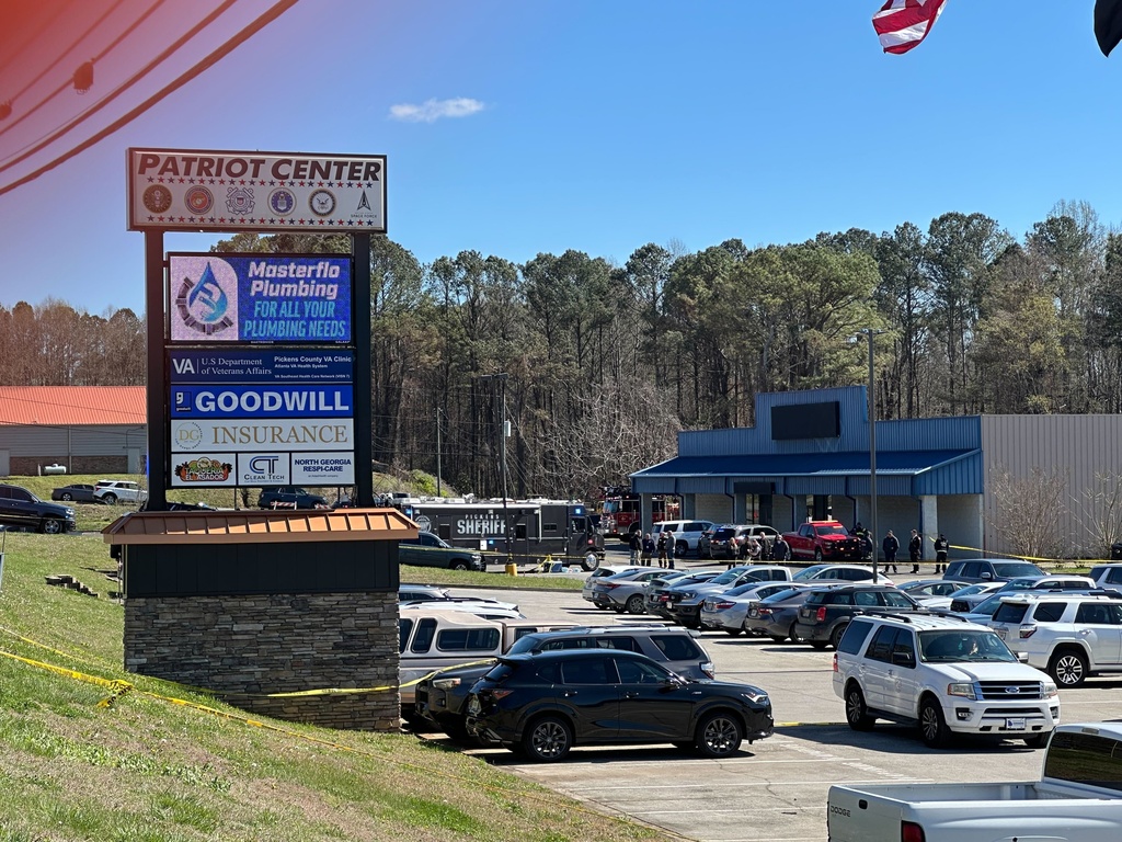 Emergency vehicles are seen outside a Department of Veterans Affairs clinic in Jasper, Ga., Tuesday, March 17, 2026. (AP Photo/Emilie Megnien)