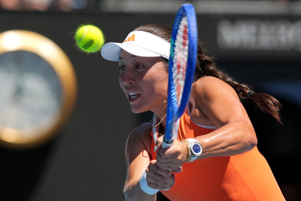 Jessica Pegula of the U.S. plays a backhand return to her compatriot Madison Keys during their fourth round match at the Australian Open tennis championship in Melbourne, Australia, Monday, Jan. 26, 2026. (AP Photo/Mark Baker)