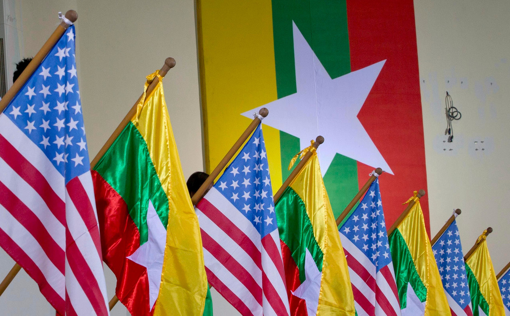 FILE - U.S. and Myanmar national flags are decorated at University of Yangon's convocation hall in Yangon, Myanmar, Nov. 19, 2012. (AP Photo/Gemunu Amarasinghe, File)