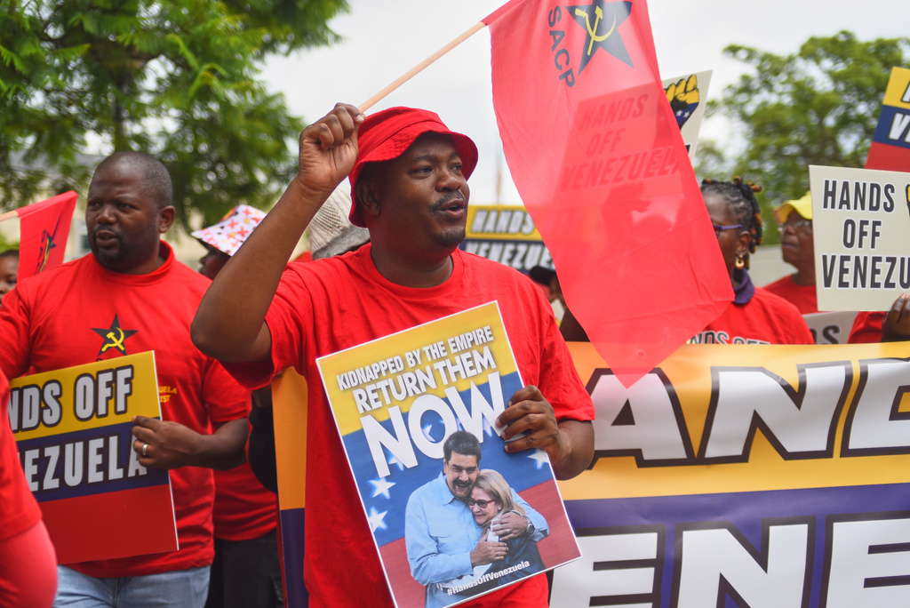 People demonstrate outside the U.S. Embassy in Pretoria, South Africa, Thursday, Jan. 8, 2026. (AP Photo/Alfonso Nqunjana)