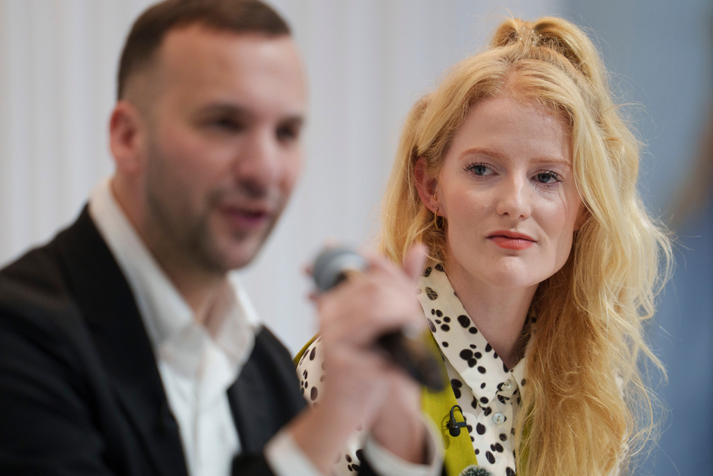 Green Party newly elected Member of Parliament Hannah Spencer looks on as party leader Zack Polanski speaks at a press conference after her win in the Gorton and Denton by-election, in Manchester, England, Friday, Feb. 27, 2026. (AP Photo/Jon Super)