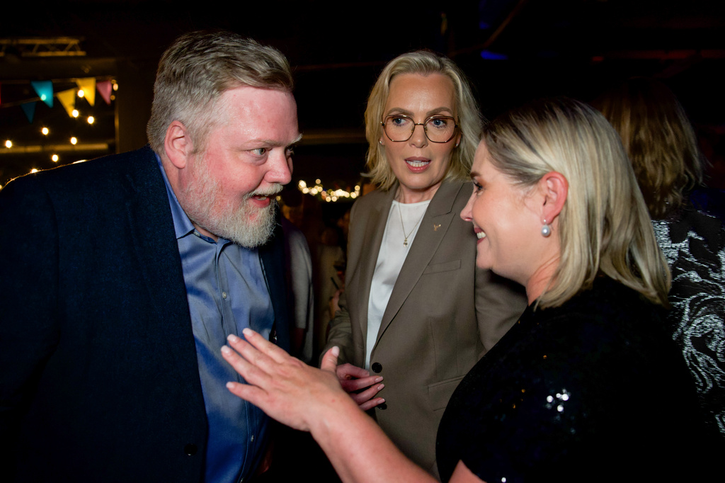 Former Icelandic Prime Minister and Centre Party leader Sigmundur Davíð Gunnlaugsson, left, Independence Party leader Guðrún Hafsteinsdóttir, center, and Progressive Party leader Lilja Dögg Alfreðsdóttir talk during a No campaign election-night gathering in Reykjavik, Iceland, Saturday, Aug. 29, 2026. (AP Photo/Marco Di Marco)