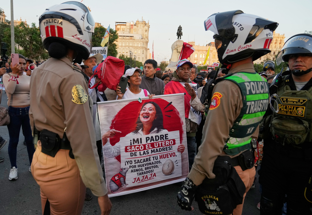 FILE - Supporters of the Together for Peru party presidential candidate Roberto Sanchez march in protest against presidential candidate Keiko Fujimori of the Popular Force party, in Lima, Peru, June 13, 2026, days after the presidential election runoff. (AP Photo/Martin Mejia, File)
