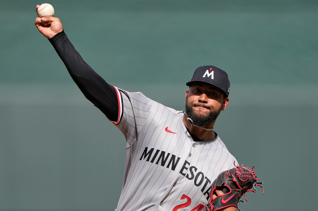 Minnesota Twins starting pitcher Simeon Woods Richardson throws during the first inning of a baseball game against the Kansas City Royals, Monday, March 30, 2026, in Kansas City, Mo. (AP Photo/Charlie Riedel)