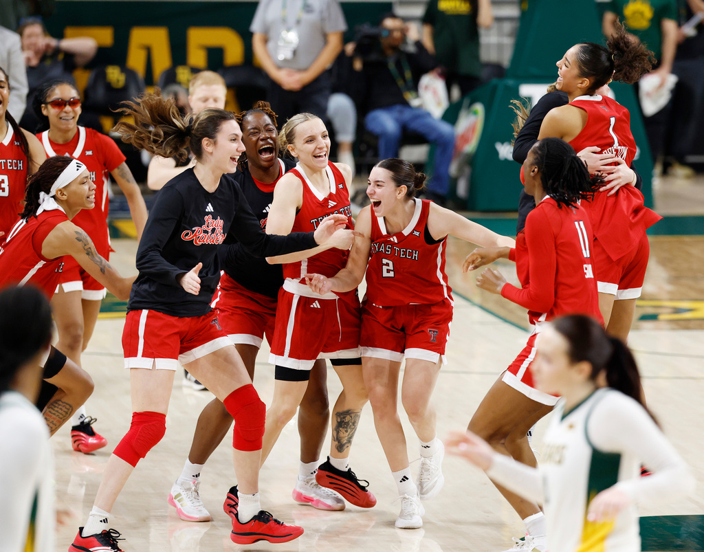 Texas Tech players celebrate on the court after defeating Baylor in an NCAA college basketball game, Sunday, Dec. 21, 2025, in Waco, Texas. (Chris Jones/Waco Tribune-Herald via AP)
